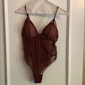 See-thru bodysuit with cup covers. NEVER WORN